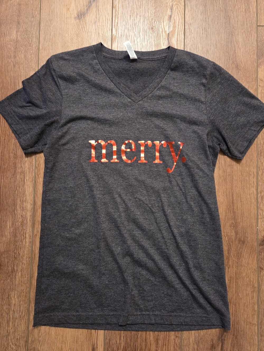 Bella Canvas Charcoal V‑Neck Tee with Red 'merry.' Text